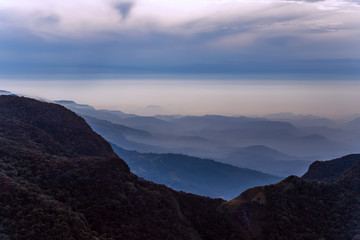 Fototapeta na wymiar Mountains Landscape cloud forest. Worlds End in Horton Plains National Park Sri Lanka.