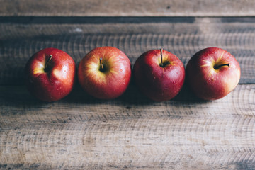 group of red apple on a wooden table