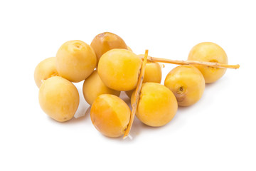 yellow raw dates isolated on white background