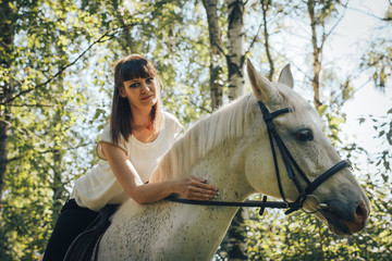 Fototapeta premium Girl and horse in the woods