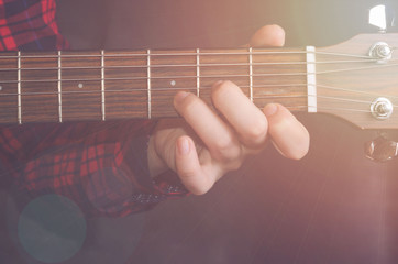  Musician Playing accord Dm on acoustic guitar, close up