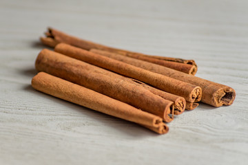 cinnamon sticks on wooden table.