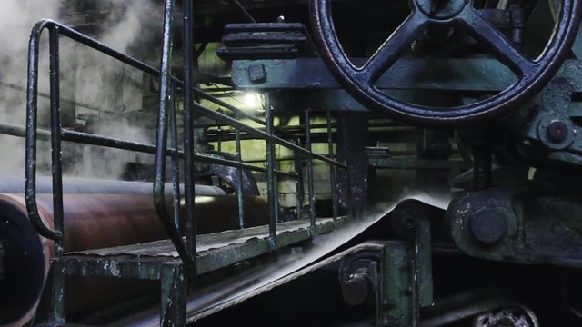 Closeup of old retro machine for pulp producing during process at pulp at old paper mill.