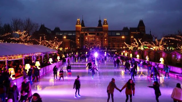 Christmas Ice Skating at the famous Museumplein in Amsterdam with the Rijksmuseum