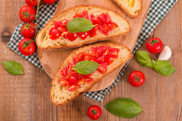 Bruschetta bread with basil and chopped tomatoes. 
