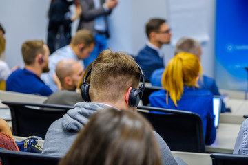 Fototapeta premium People attend business conference in the congress hall