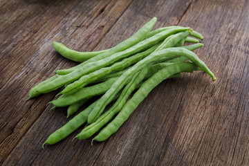Organic Green Vegetable Cordyceps, which are vegetarian vital vitamins, beans on the wood tabletop,