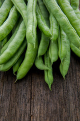 Organic Green Vegetable Cordyceps, which are vegetarian vital vitamins, beans on the wood tabletop,