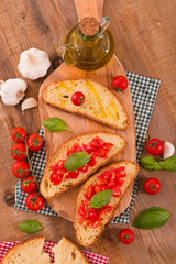 Bruschetta bread with basil and chopped tomatoes. 