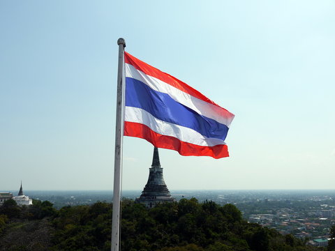 Thai national flag and stupa of Buddhist temple