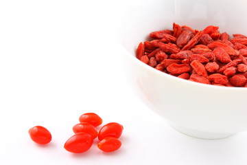 dried goji berries in a small white bowl