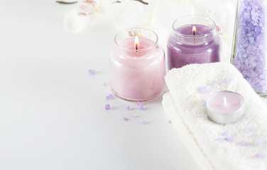Fototapeta na wymiar Spa concept.Sea salt, candles,towels, orchid flowers