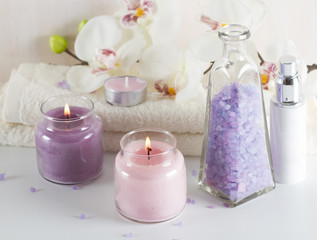 Fototapeta na wymiar Spa concept.Sea salt, candles,towels, orchid flowers
