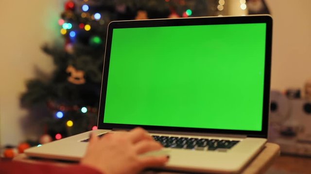 girl hand using digital laptop modern device blank screen mockup text content internet surfing wireless gadget information technology developer xmas tree decoration chromakey touchpad data web browser