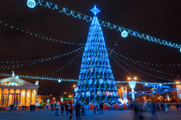 City Christmas and New Year illuminations and decorations in town square, Christmas tree. Minsk, Belarus