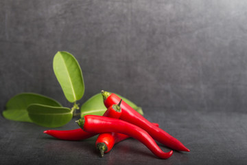 chili peppers on a grey stone background
