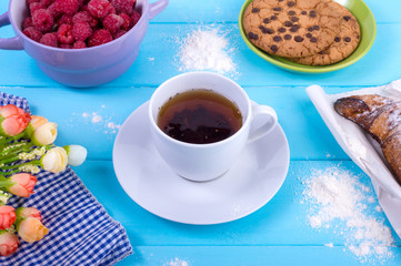 Baking and a cup of tea on a blue table