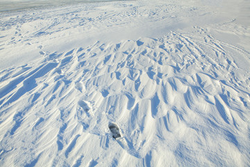 winter snowy surface with footprints 