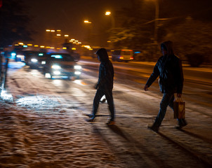 Busy city street people on zebra crossing at night