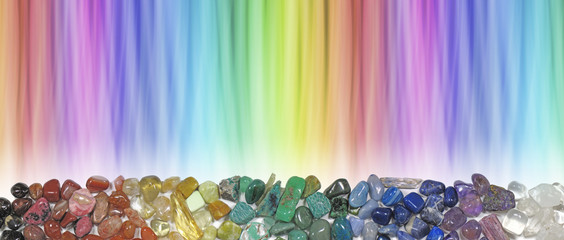 Magnificent Multicoloured Chakra Healing Stones header - wide rainbow coloured graduated banner copy space above with crystal healer's row of chakra coloured tumbled crystal selection below 
 - obrazy, fototapety, plakaty