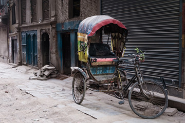 Fototapeta na wymiar tricycle park beside old building, Kathmandu, Nepal