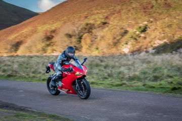 Motorbike Panning / Panning motorbike at speed to create motion blur on a country road in Upper Coquetdale, Northumberland