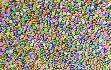 Colorful sweet hearts candies background texture pattern