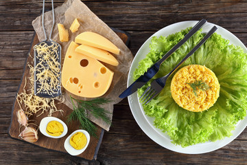 cheese salad and ingredients on cutting board