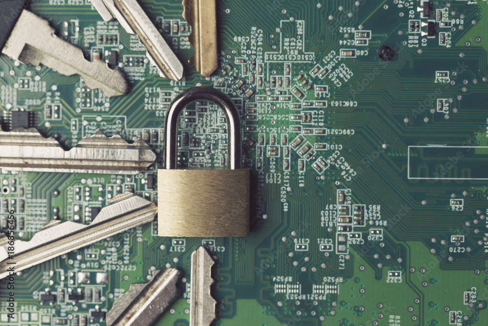 Poster padlock on a computer electronic circuit board. technology security concept