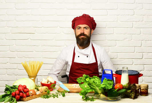 Chef prepares meal. Cooking process concept. Man with beard