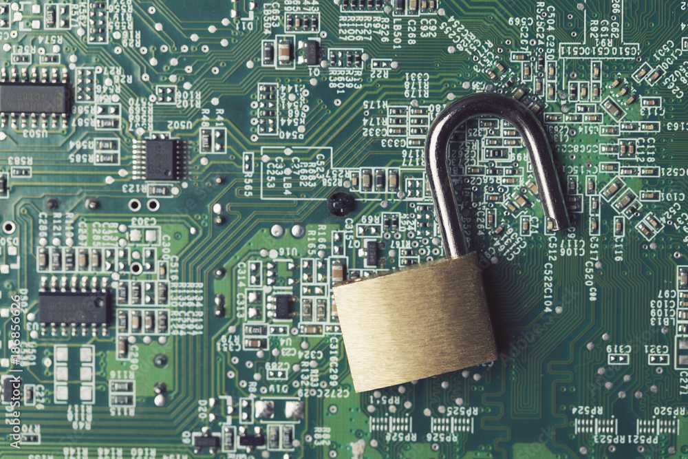 Poster padlock on a computer electronic circuit board. technology security concept