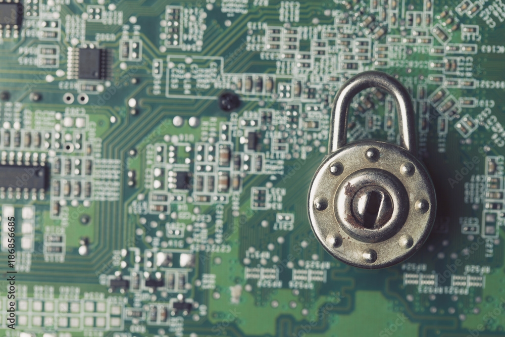 Poster padlock on a computer electronic circuit board. technology security concept
