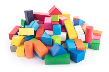 Obraz premium Wooden toys, colorful children's designer on white background, entertainment with a kid, development of preschoolers, construction, game, can move object right or left for create space for text