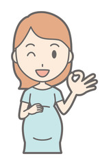 A pregnant woman in green dress is playing an okay sign