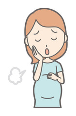 A pregnant woman in green clothes is sighing