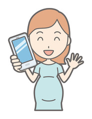 A pregnant woman in green's clothes has a smartphone