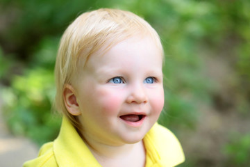 Boy infant smile with blue eyes on adorable face