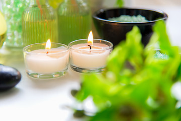 Obraz na płótnie Canvas Thai Spa Treatments aroma therapy salt and nature green sugar scrub and rock massage with green orchid flower on wooden white with candle. Thailand. Healthy Concept. copy space,select and soft focus