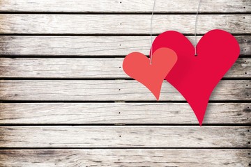 Two Red Hearts Hanging On Old White Painted Wood Wall
