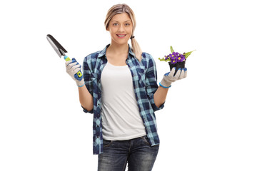 Female gardener with a spade and a flower pot