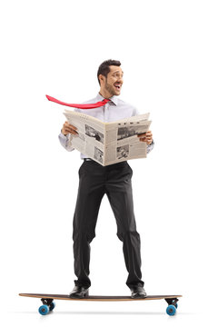 Businessman with a newspaper riding a longboard