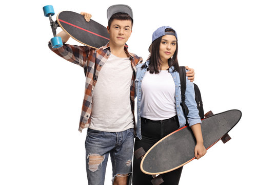 Teenage boy and a teenage girl with longboards