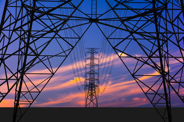 Silhouette image. High voltage tower and Colorful sky.