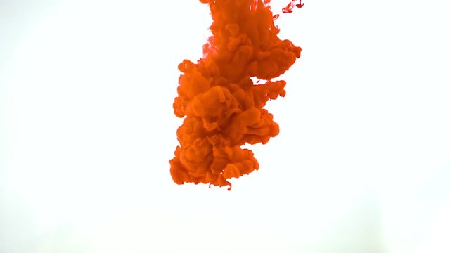 Red ink in water, slow motion, abstract.