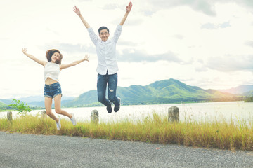 Women lovers jumping together for take a photo for the best memories between travel.