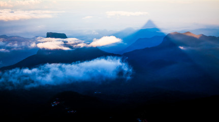 Shadow of the conical mountain Adam's Peak - sacred buddhist place