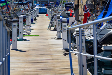 Wooden port bridge with chargers to yachts in Puerto De Mogan on Gran Canaria.
