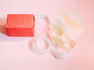 wrap and pack item for present box for give and celebration christmas , birthday or new year with pink pastel background