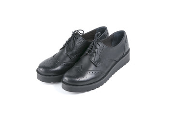 Female black leather shoe on white background, isolated product, comfortable footwear.