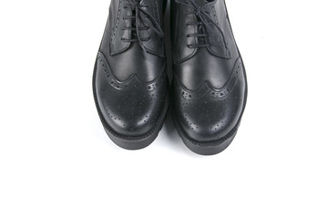 Female black leather shoe on white background, isolated product, comfortable footwear.